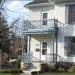 Two storey porch with custom railings